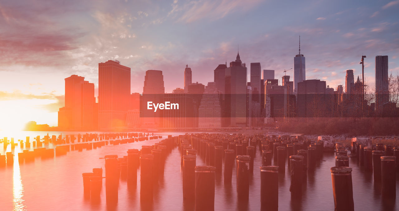 Panoramic view of city against sky during sunset