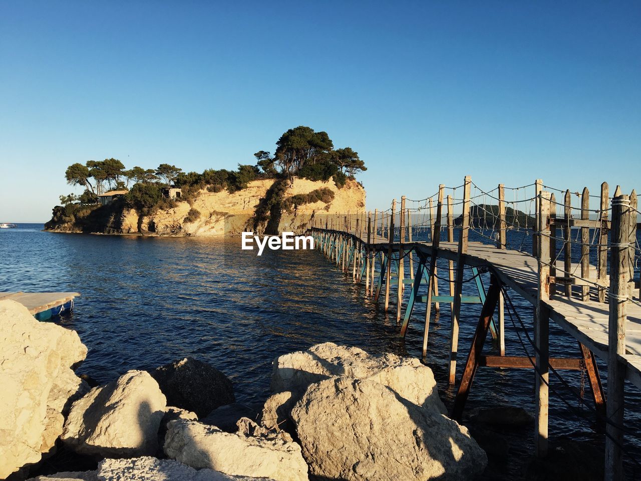 Scenic view of sea against clear blue sky