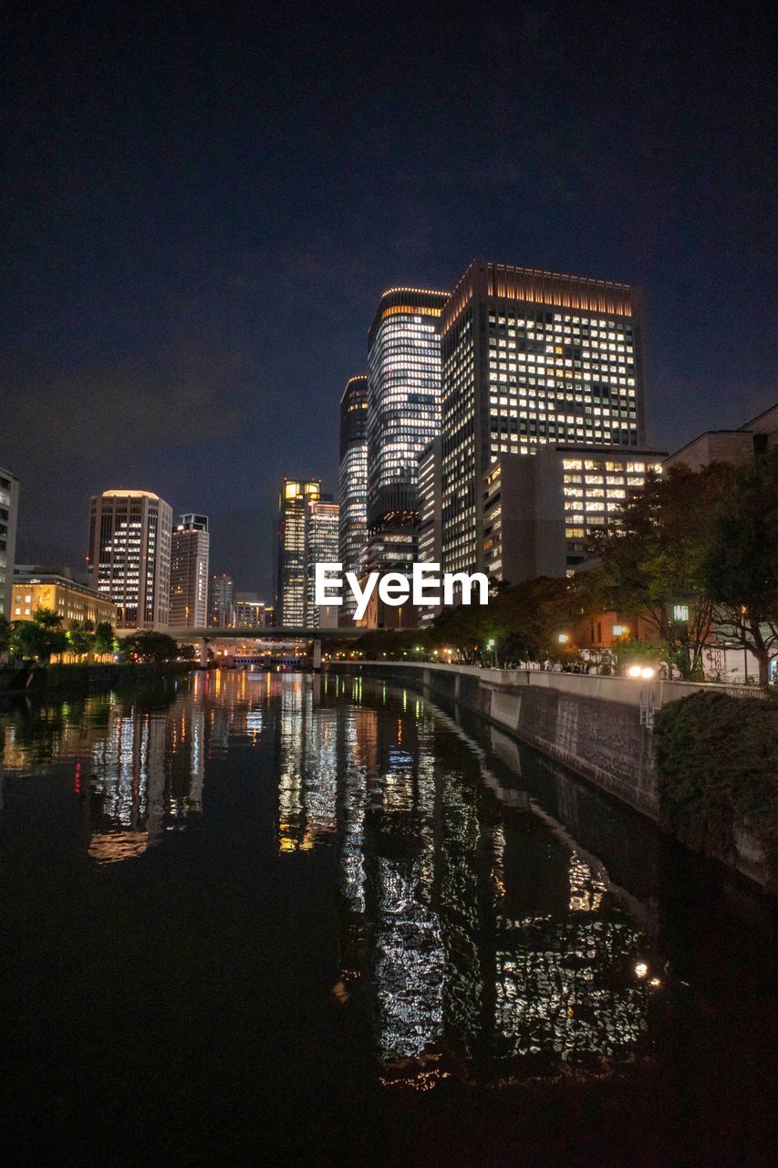 Illuminated buildings in city at night