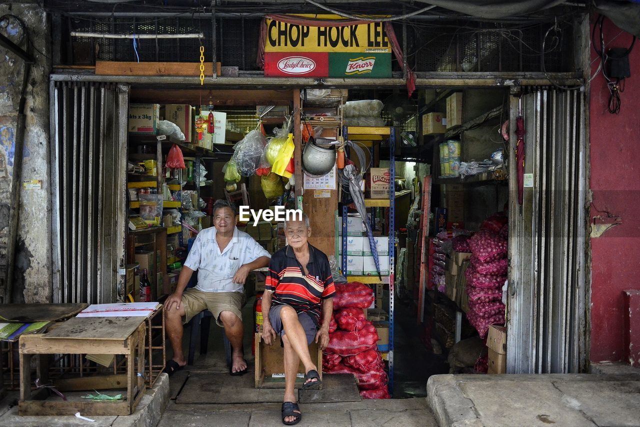 MAN WORKING IN MARKET