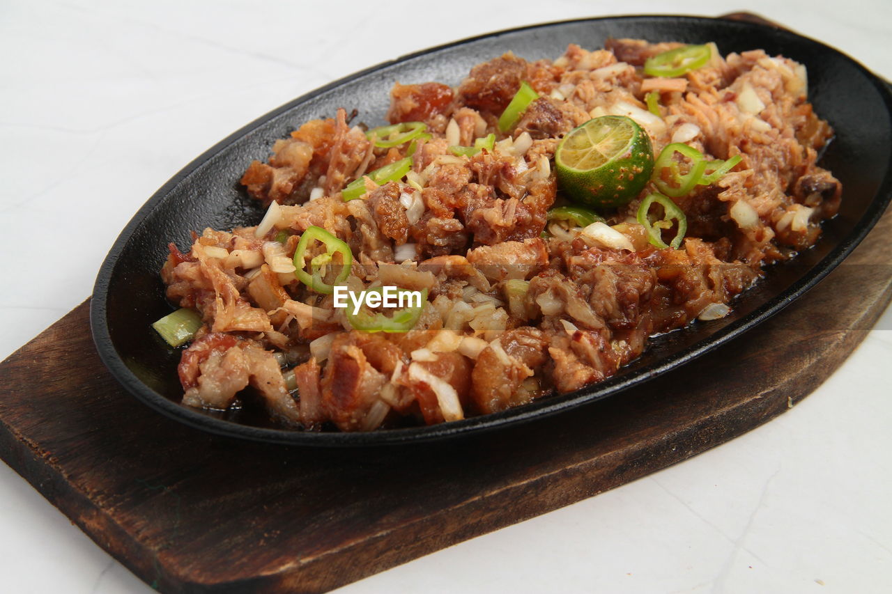 Photo of freshly cooked filipino food called pork sisig.