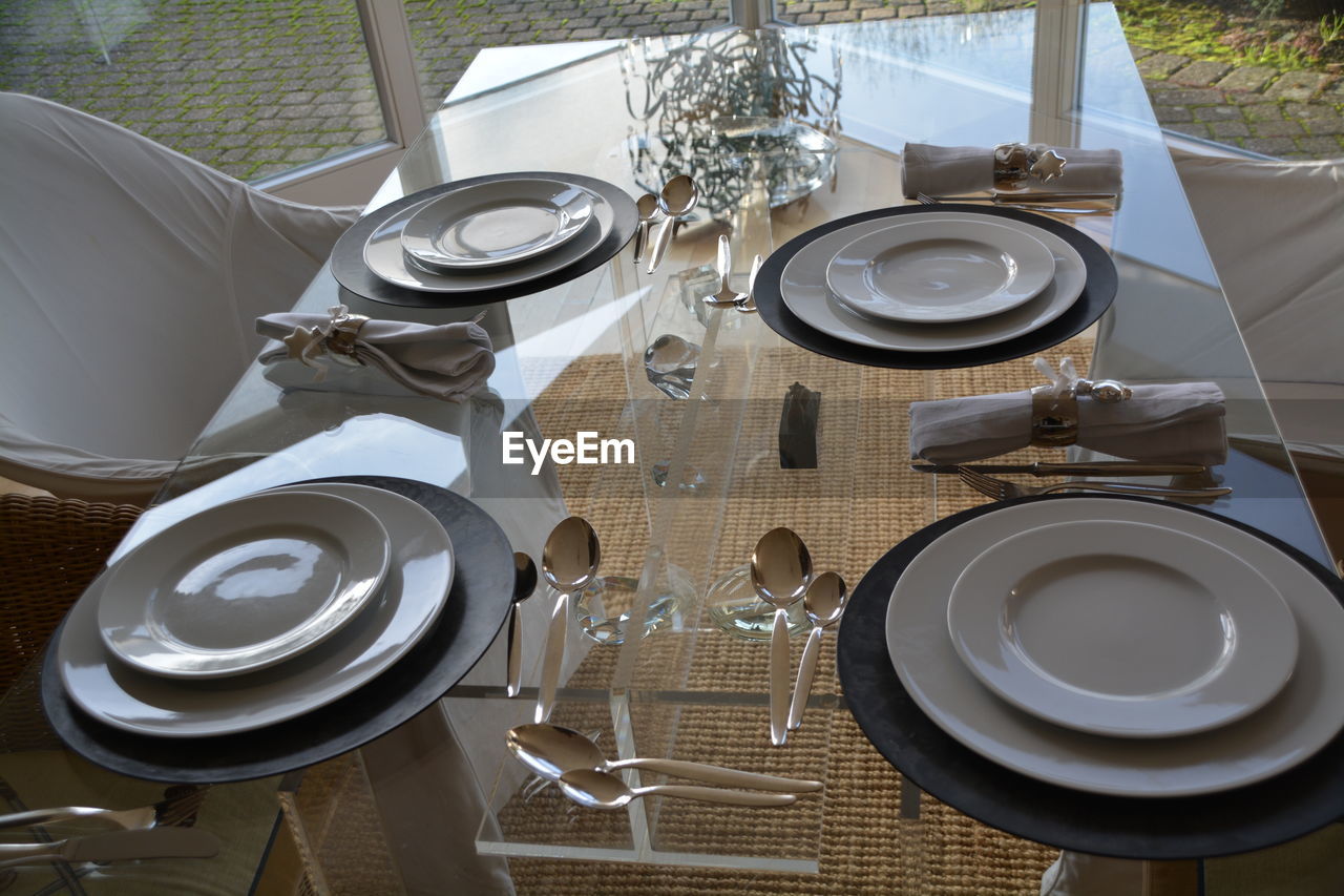 High angle view of crockery on dining table at home