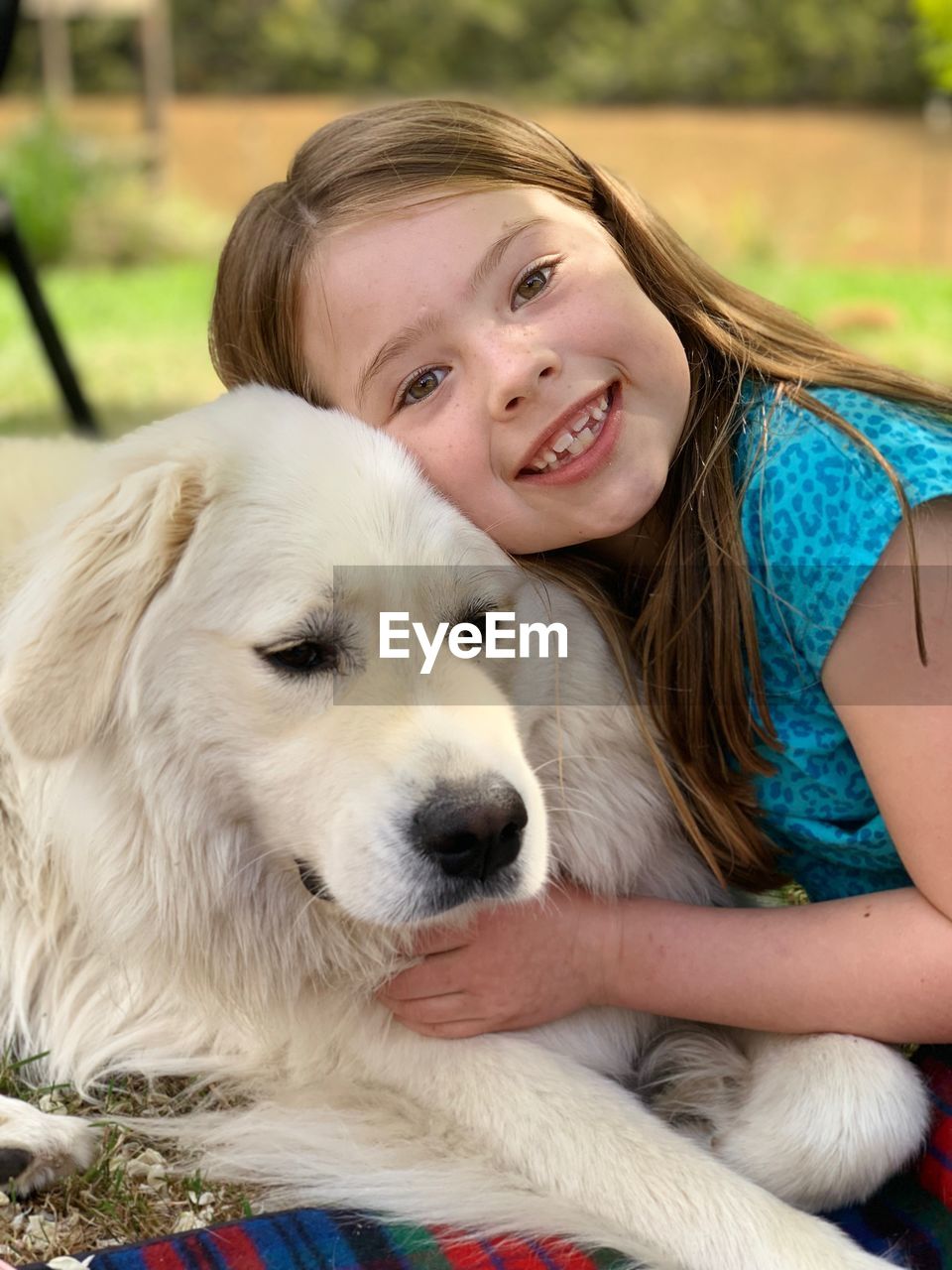 Portrait of smiling girl with dog