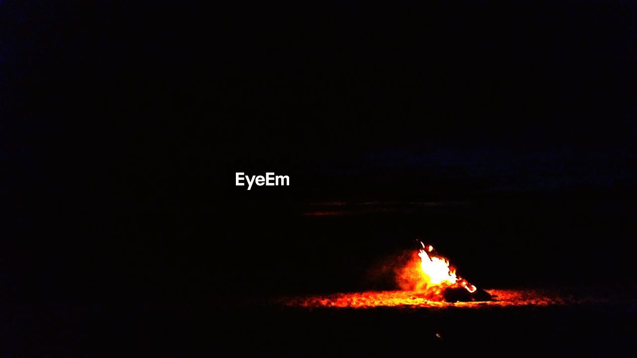 Bonfire on beach in night