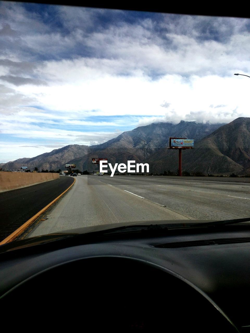 Empty road along countryside landscape