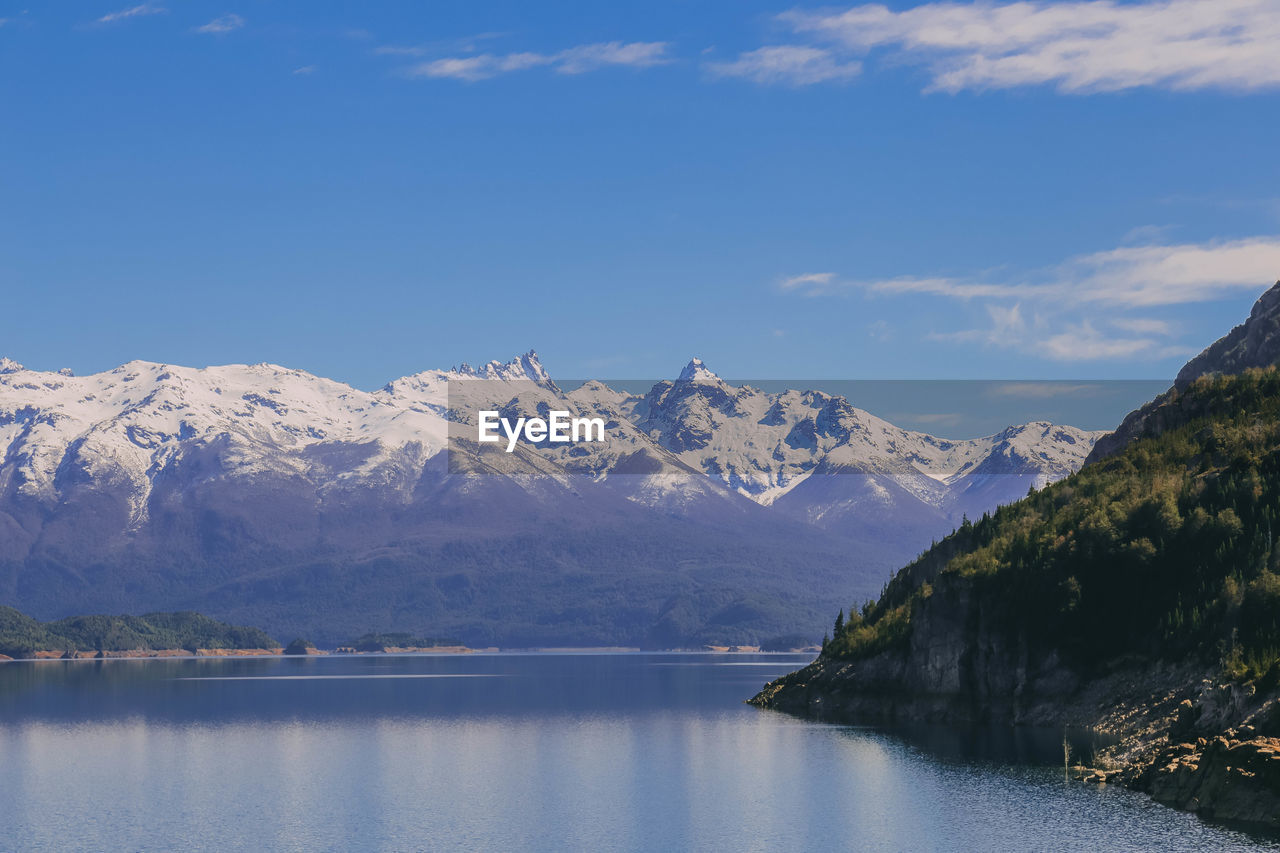 Scenic view of snowcapped mountains and lake against sky