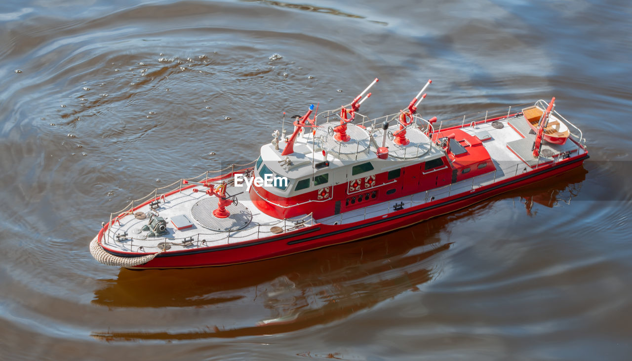 Remote controlled ship model is remote controlled on a lake