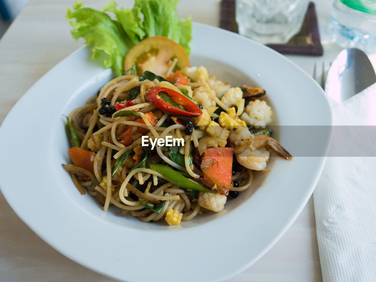 Close-up of spaghetti in plate served on table