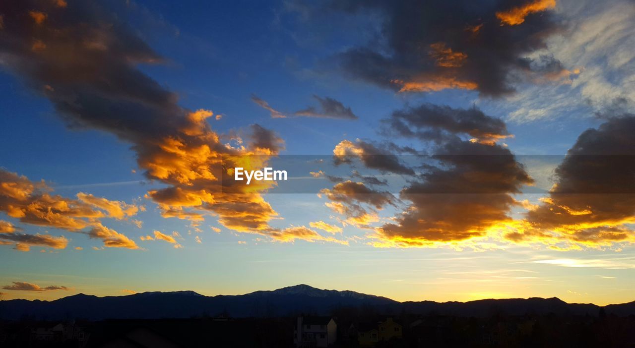 SCENIC VIEW OF DRAMATIC SKY OVER SILHOUETTE TREES