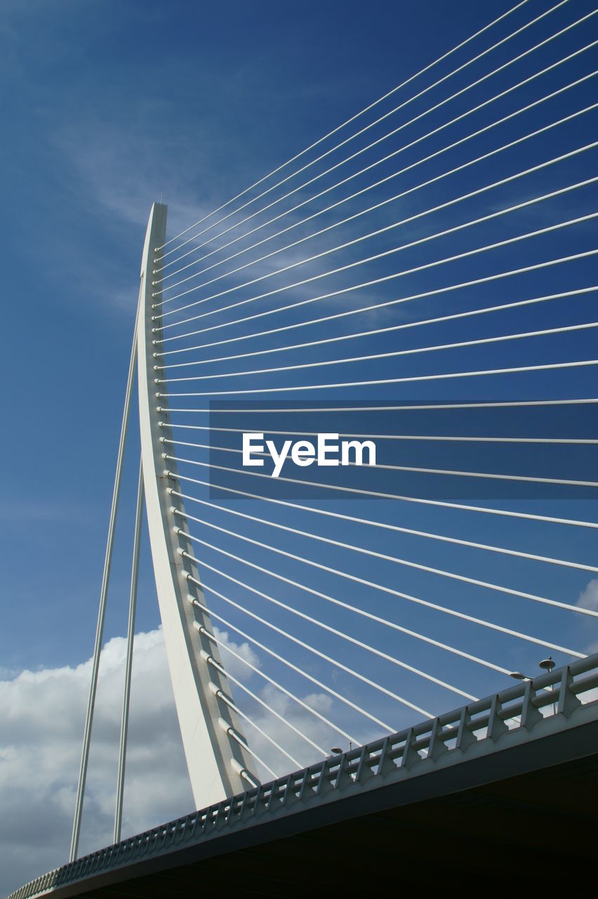 LOW ANGLE VIEW OF BRIDGE AGAINST SKY IN CITY