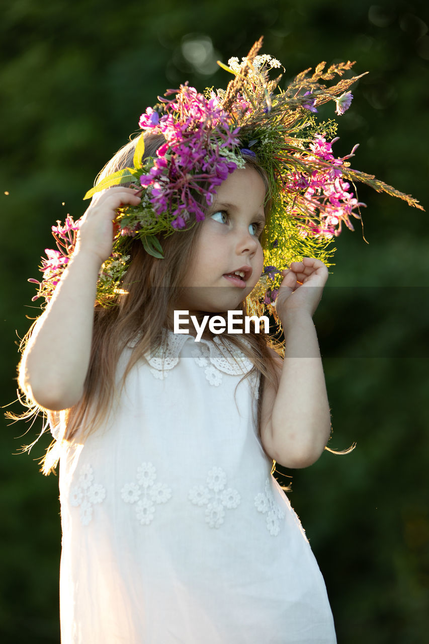 Beautiful little girl in a wreath