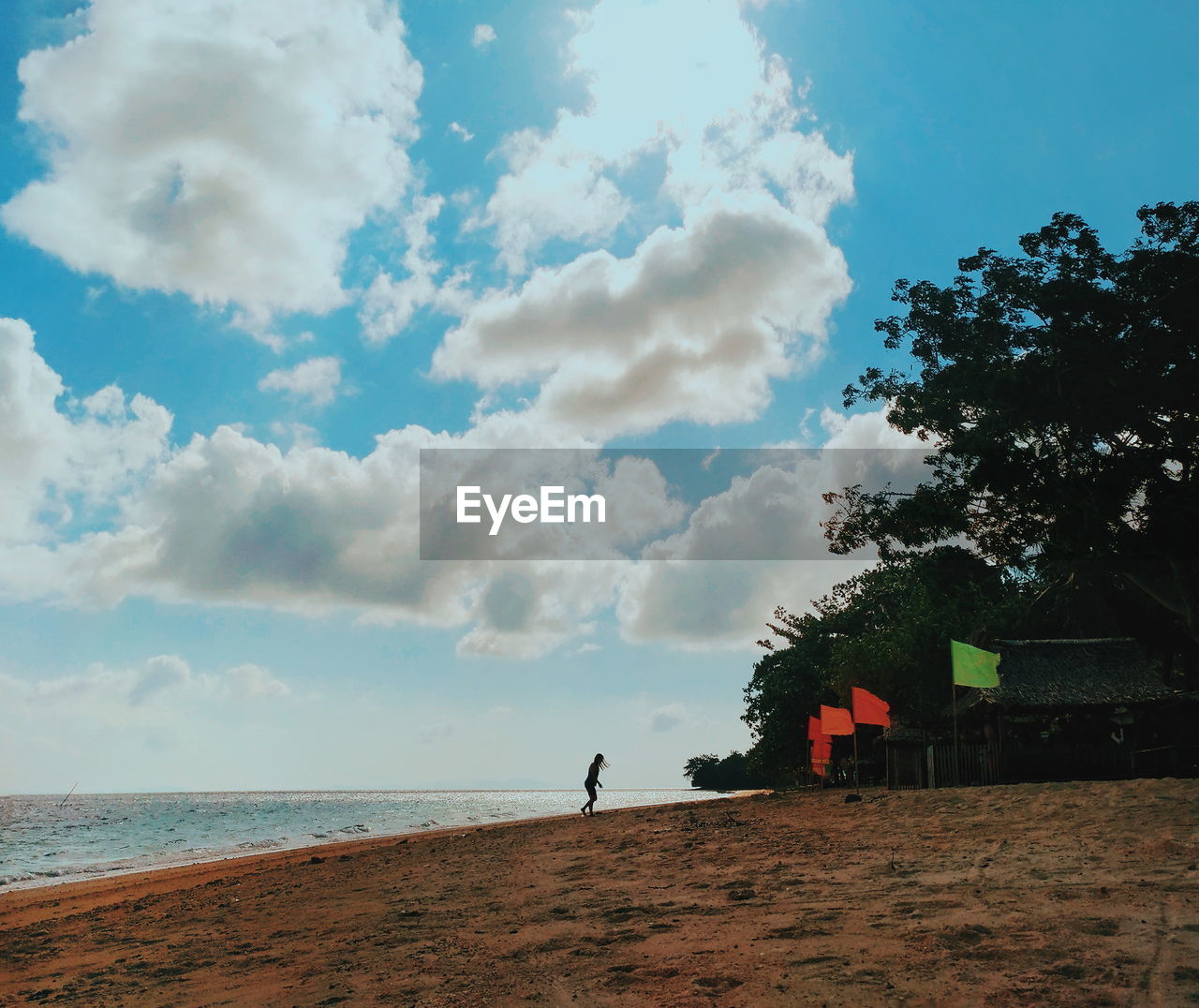 SCENIC VIEW OF BEACH AGAINST SKY DURING SUNSET