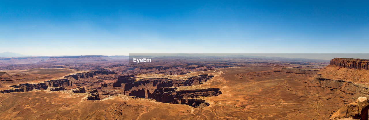 Aerial view of rock formations against sky