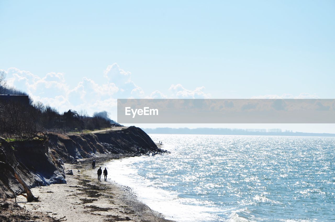 Scenic view of sea against sky during sunny day