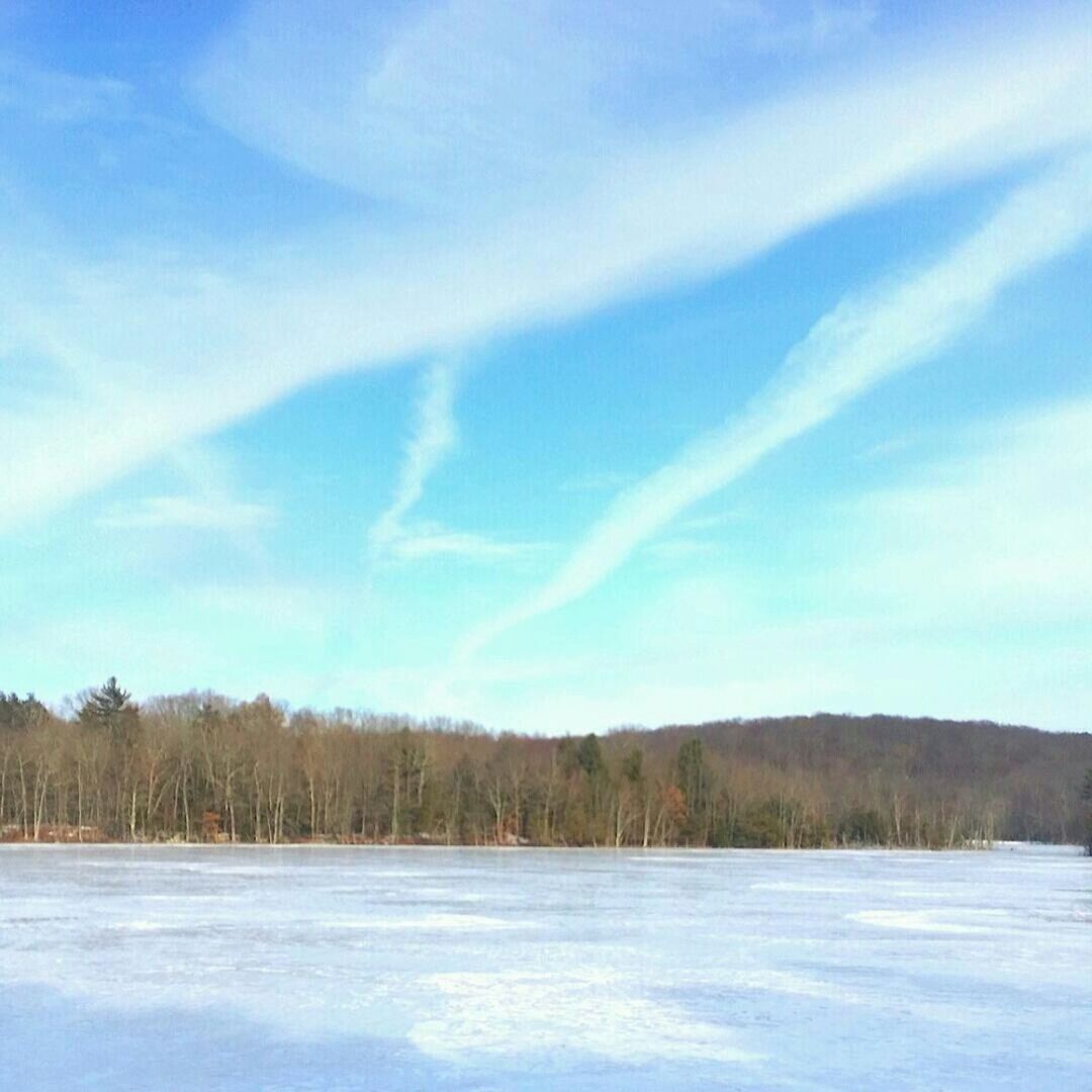 Cloudy sky above frozen lake