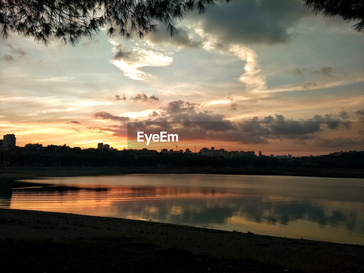 SCENIC VIEW OF SUNSET OVER LAKE