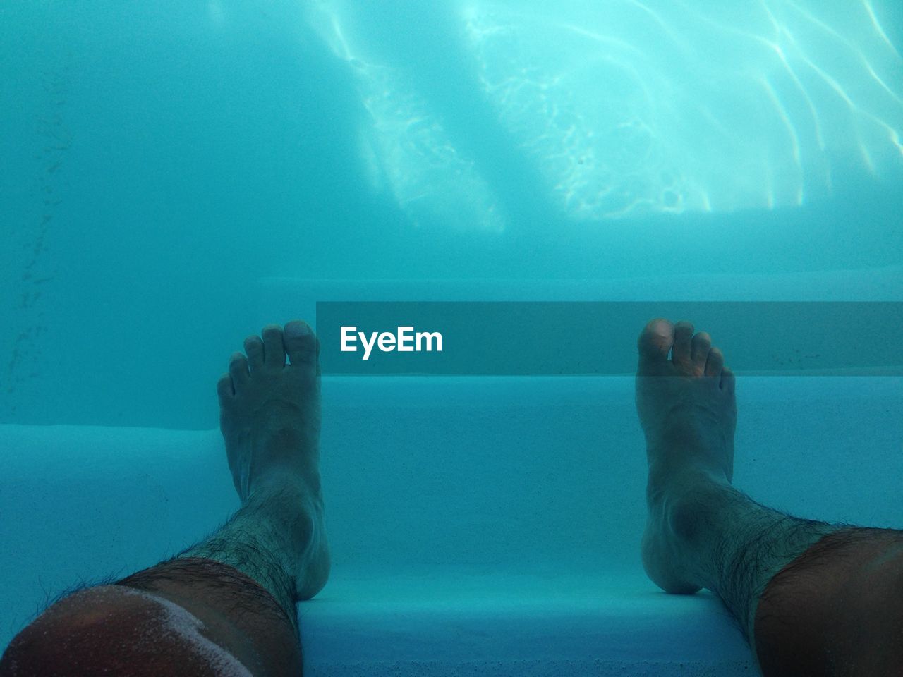 Human legs in water