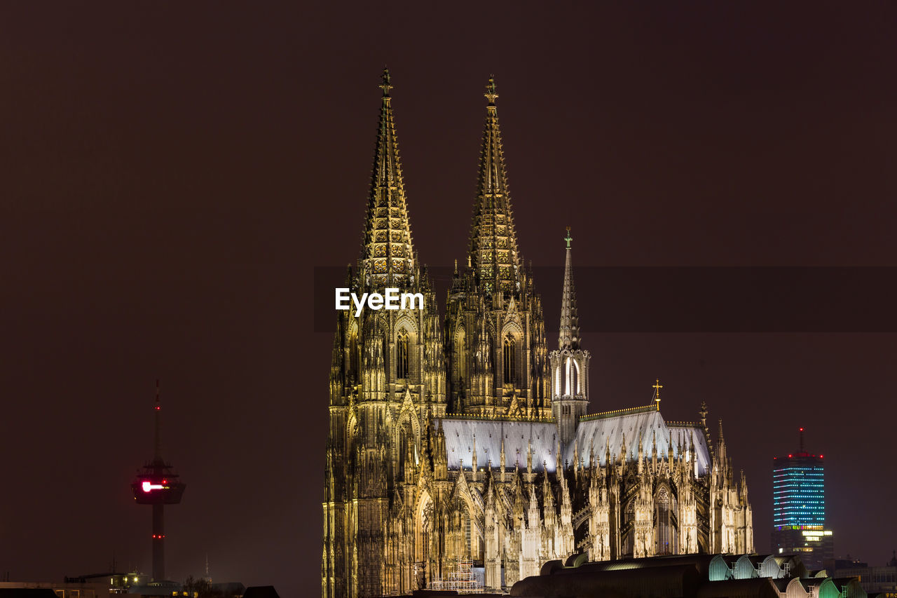 ILLUMINATED BUILDING AGAINST SKY AT NIGHT