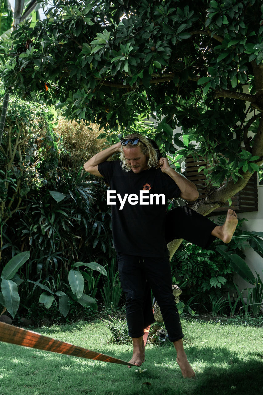 Full length of man standing in yard