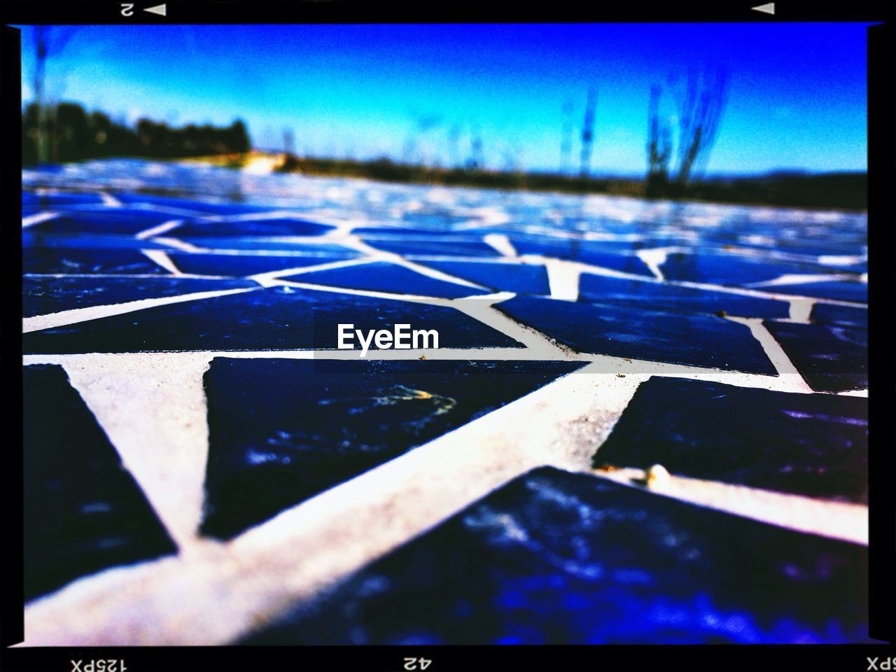 CLOSE-UP OF WATER AGAINST BLUE SKY