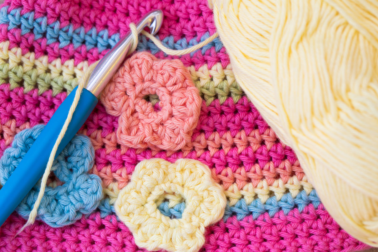 Close-up of flowers on wool