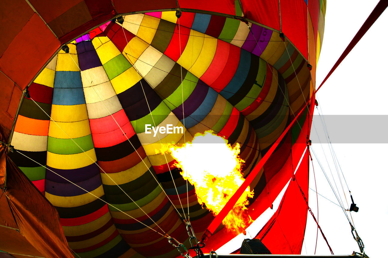 LOW ANGLE VIEW OF MULTI COLORED HOT AIR BALLOON