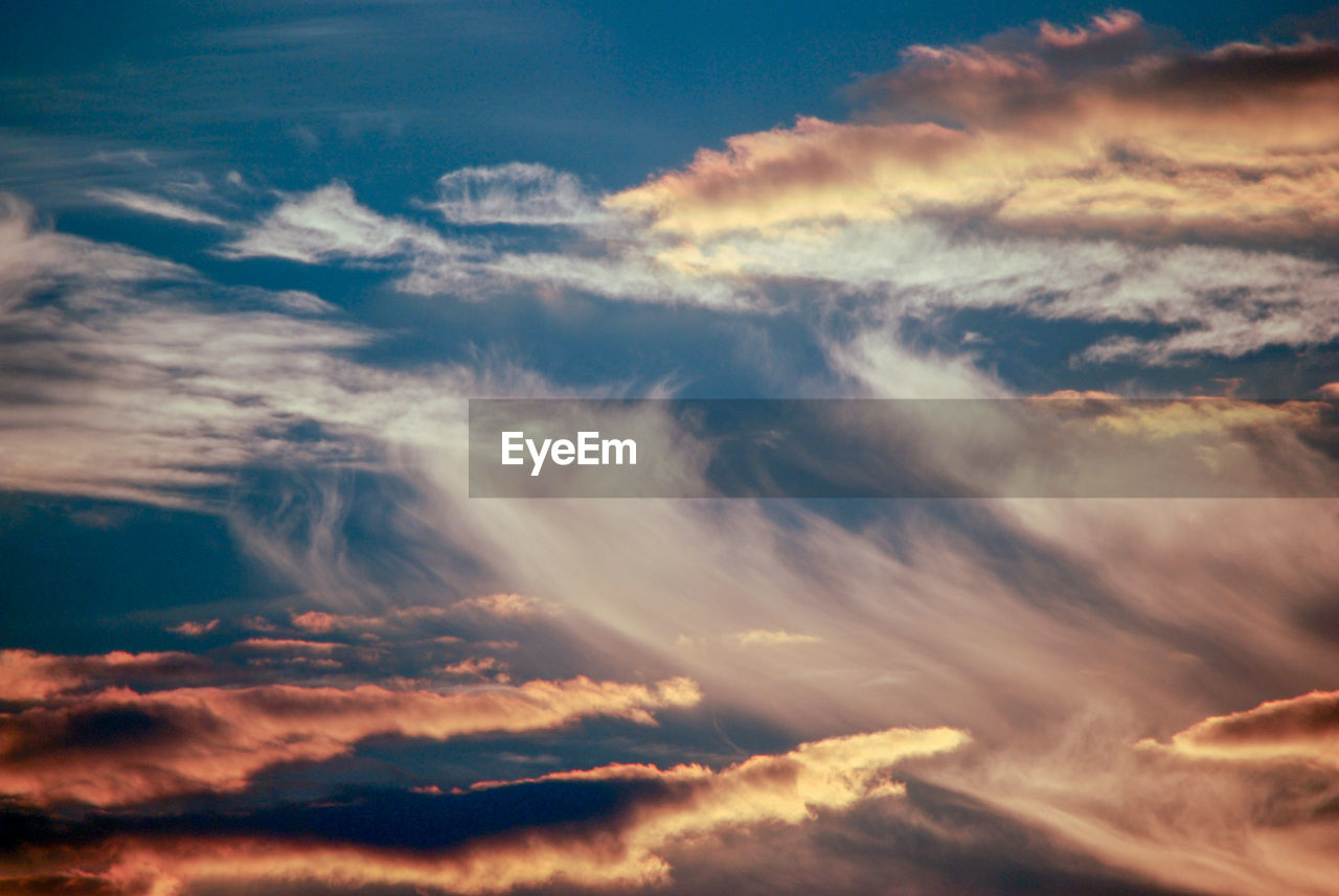 Low angle view of clouds in sky during sunset