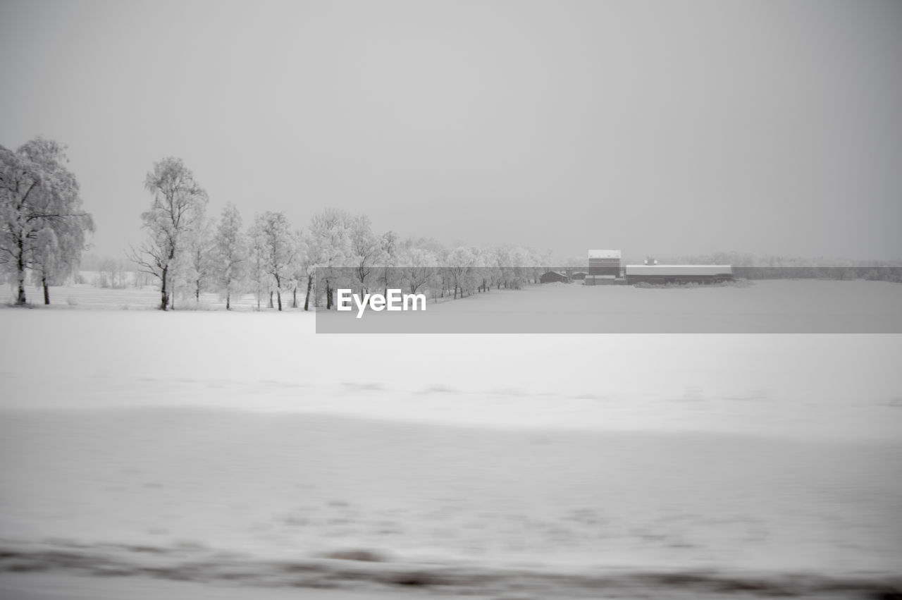 SCENIC VIEW OF SNOW COVERED LAND