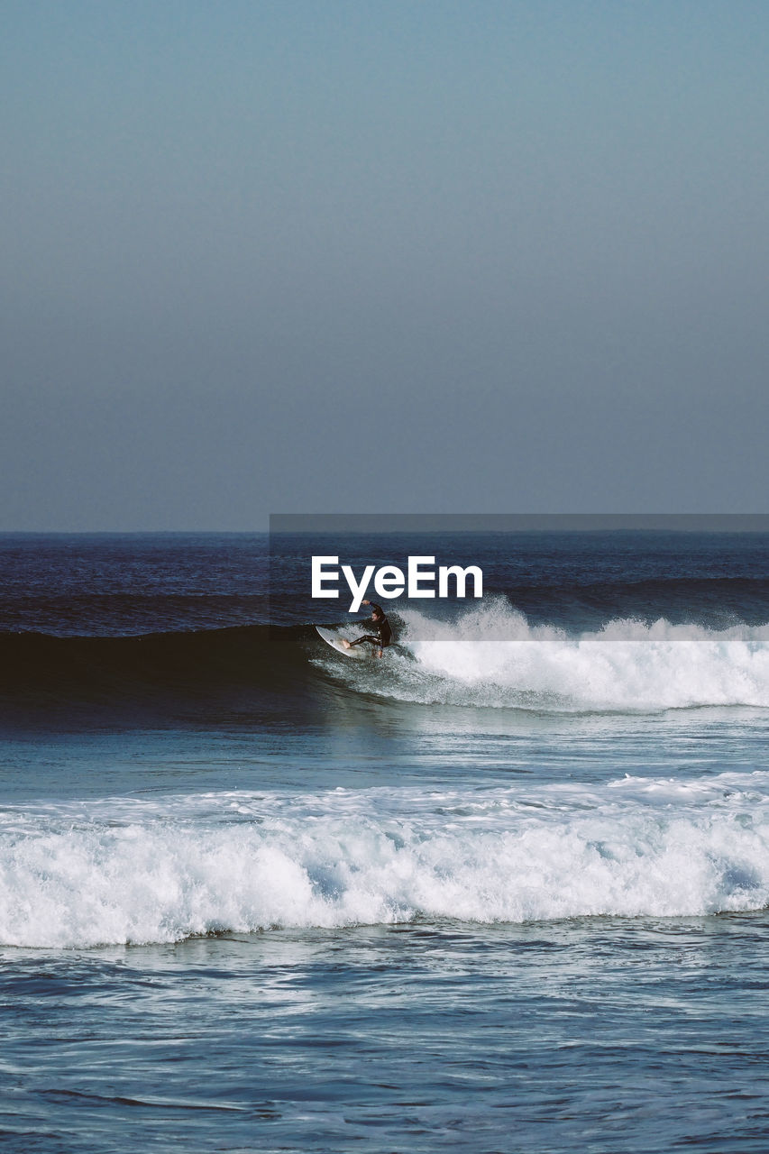 Man surfing on sea