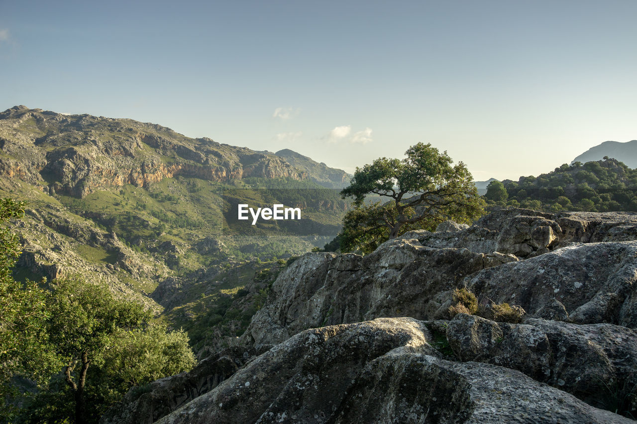 Scenic view of rocky mountains against clear sky