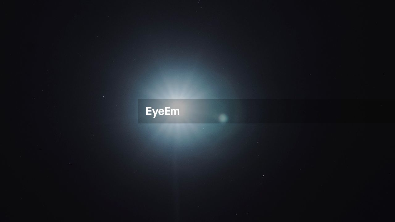 Low angle view of moon against sky at night