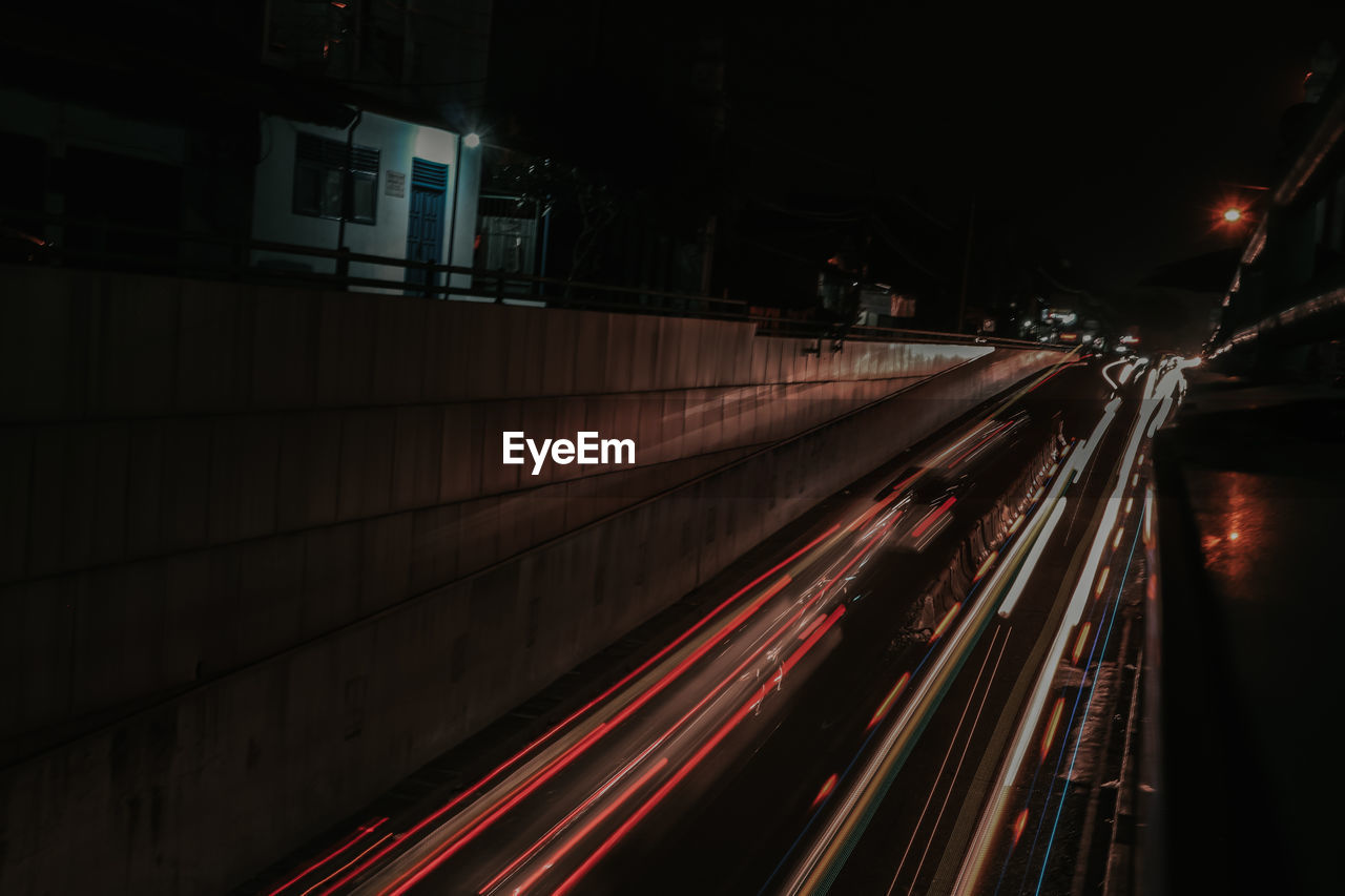 High angle view of light trails on road at night