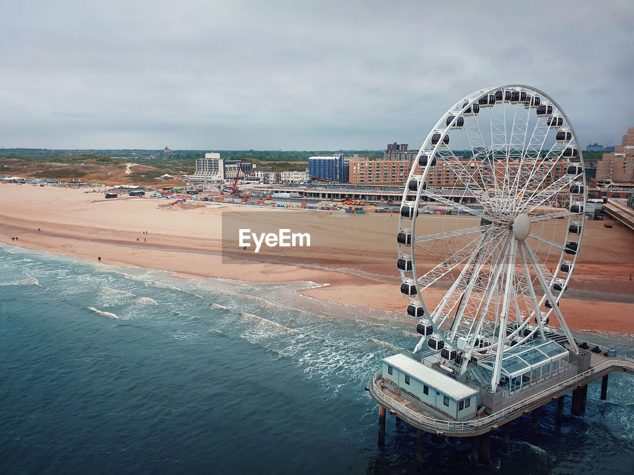 Aerial cityscape of the ferris wheel and the de pier in hague, the netherlands. gloomy day