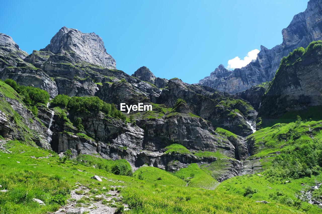 SCENIC VIEW OF ROCKS AGAINST CLEAR SKY