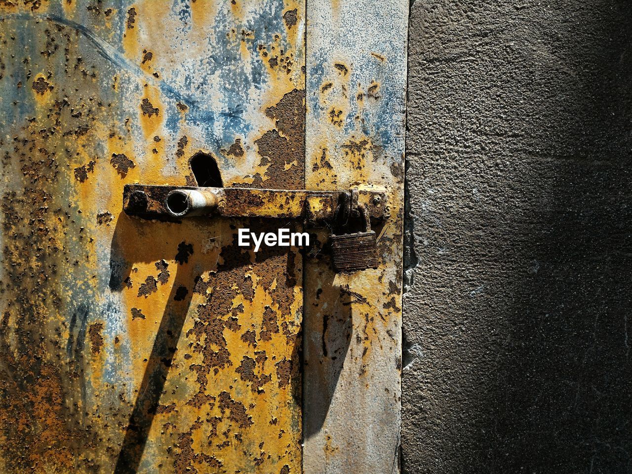 Close-up of rusty locked door