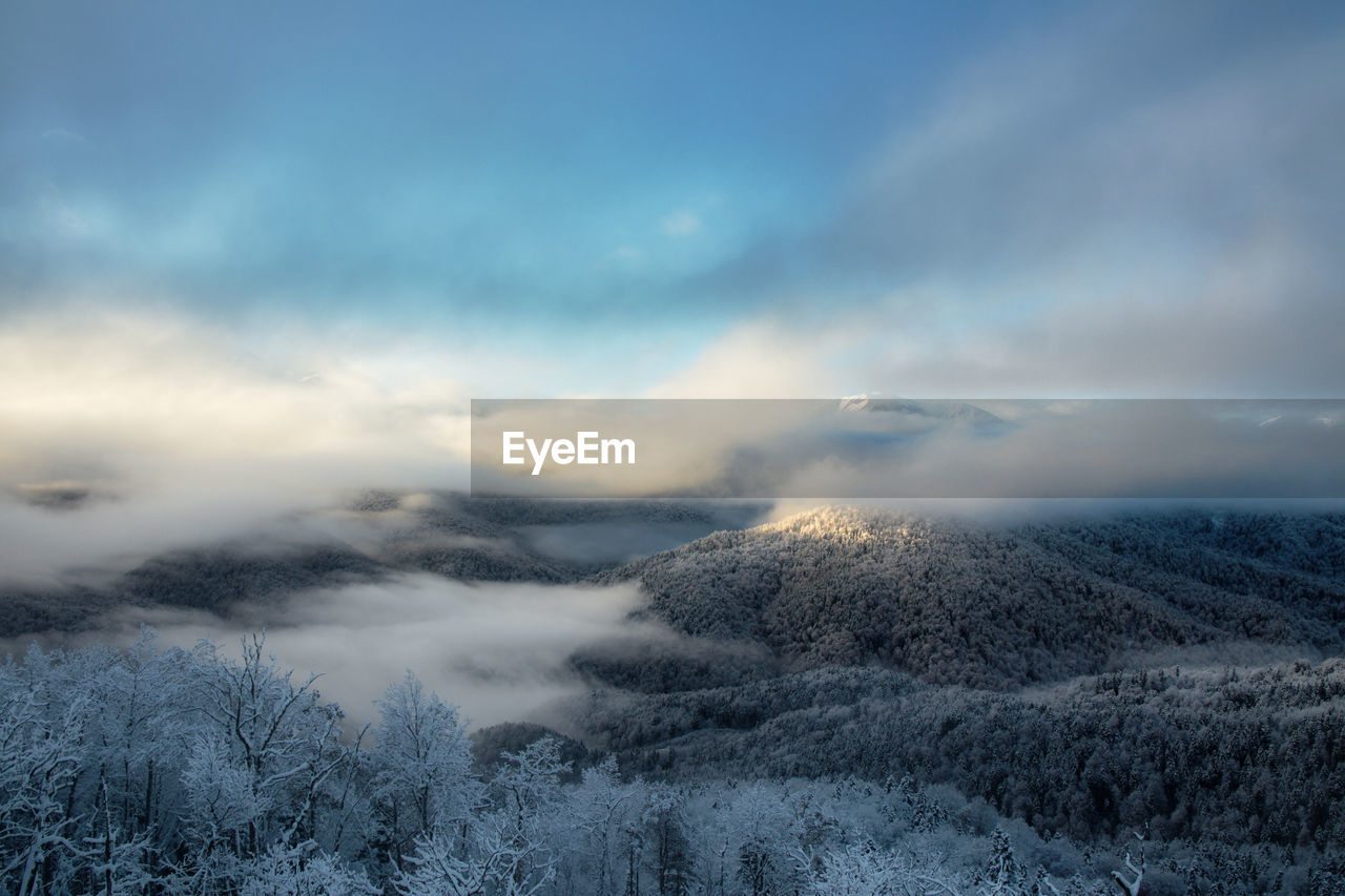 scenic view of mountains against sky during sunset