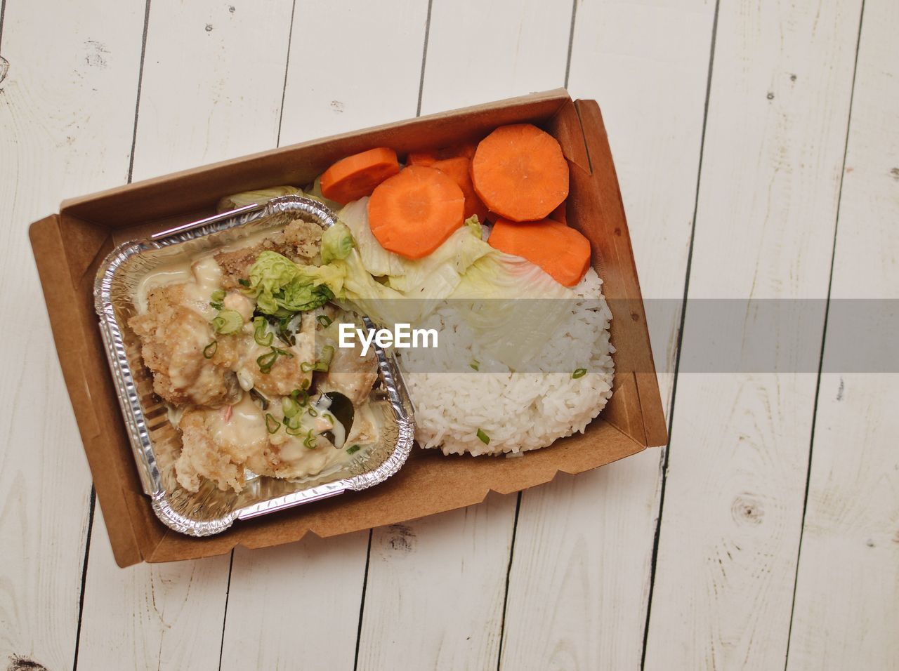 HIGH ANGLE VIEW OF BREAKFAST ON WOODEN TABLE