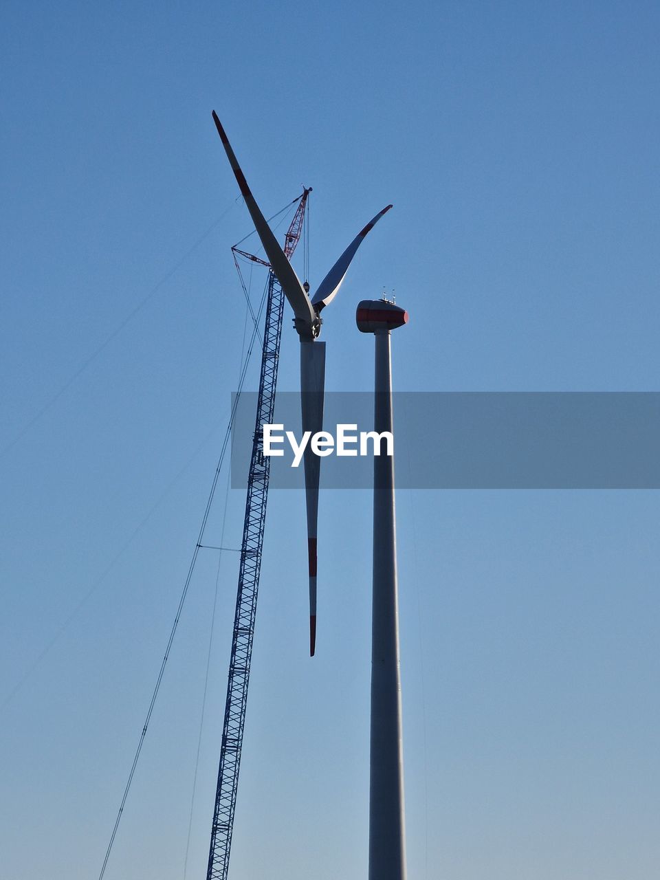 sky, blue, clear sky, line, nature, no people, mast, wing, day, copy space, low angle view, sunny, outdoors, wind, technology, power generation, electricity, transportation