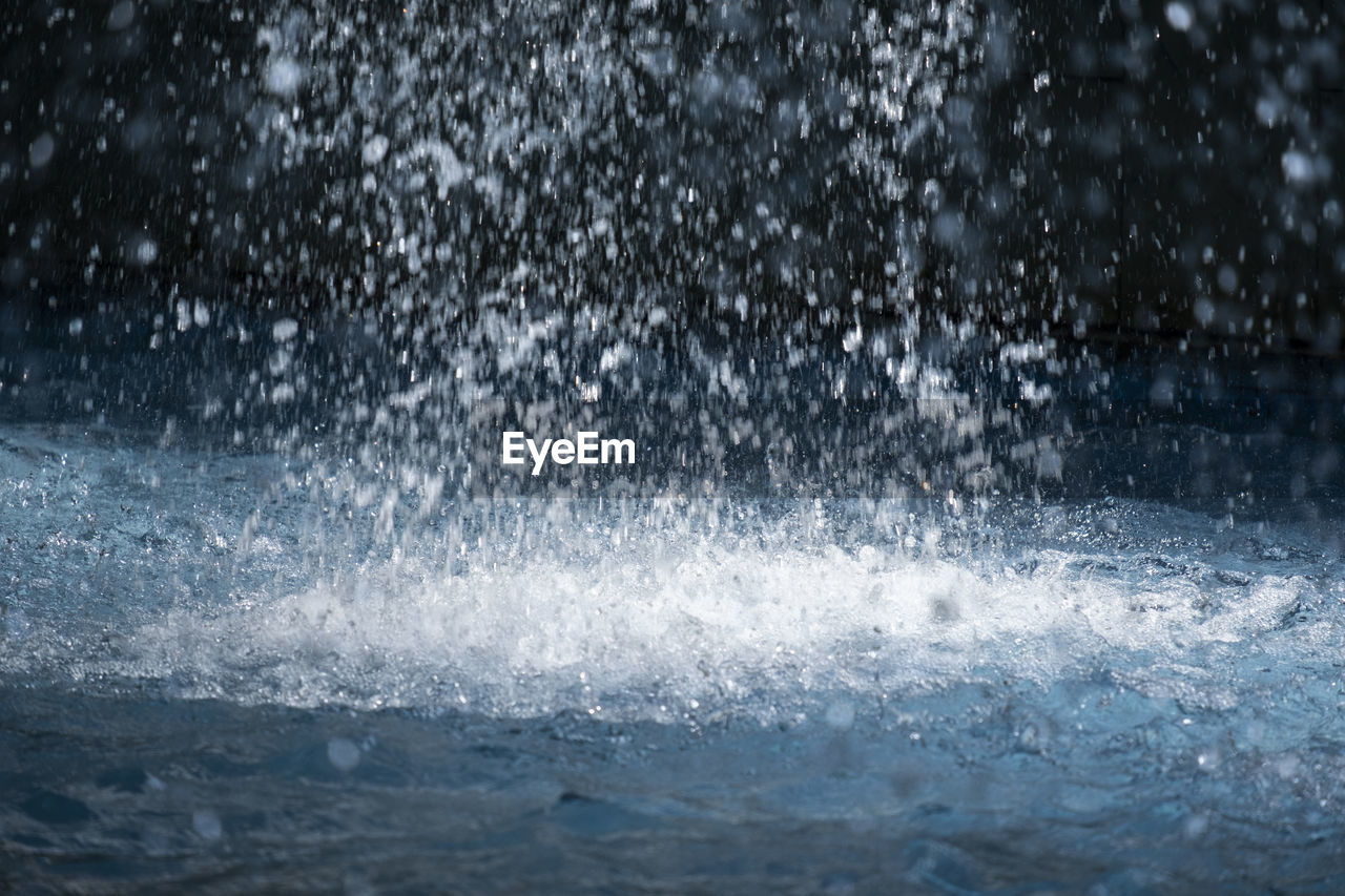 Water of fountain in the park close-up