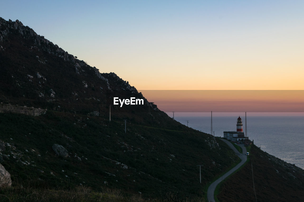 Cabo silleiro lighthouse located on a mountain next to the sea