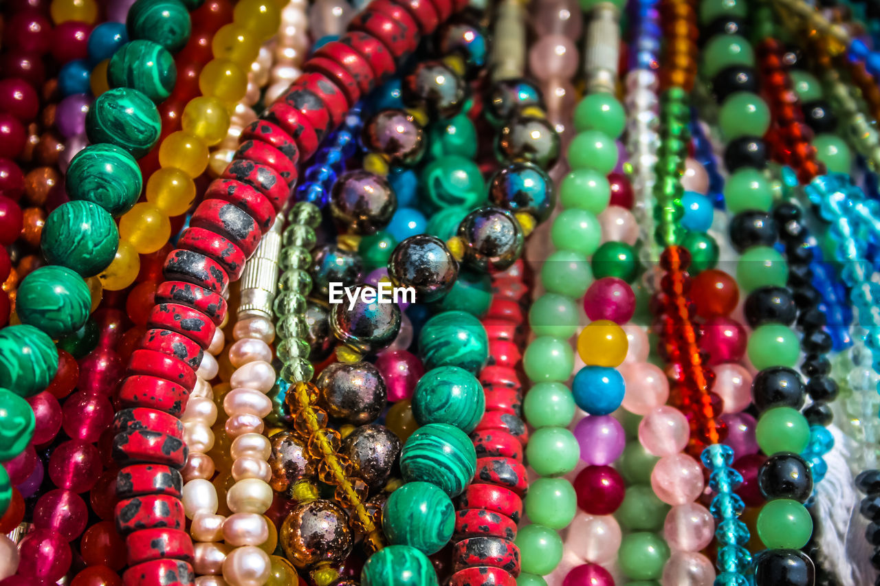 Close-up of multi colored jewelry for sale