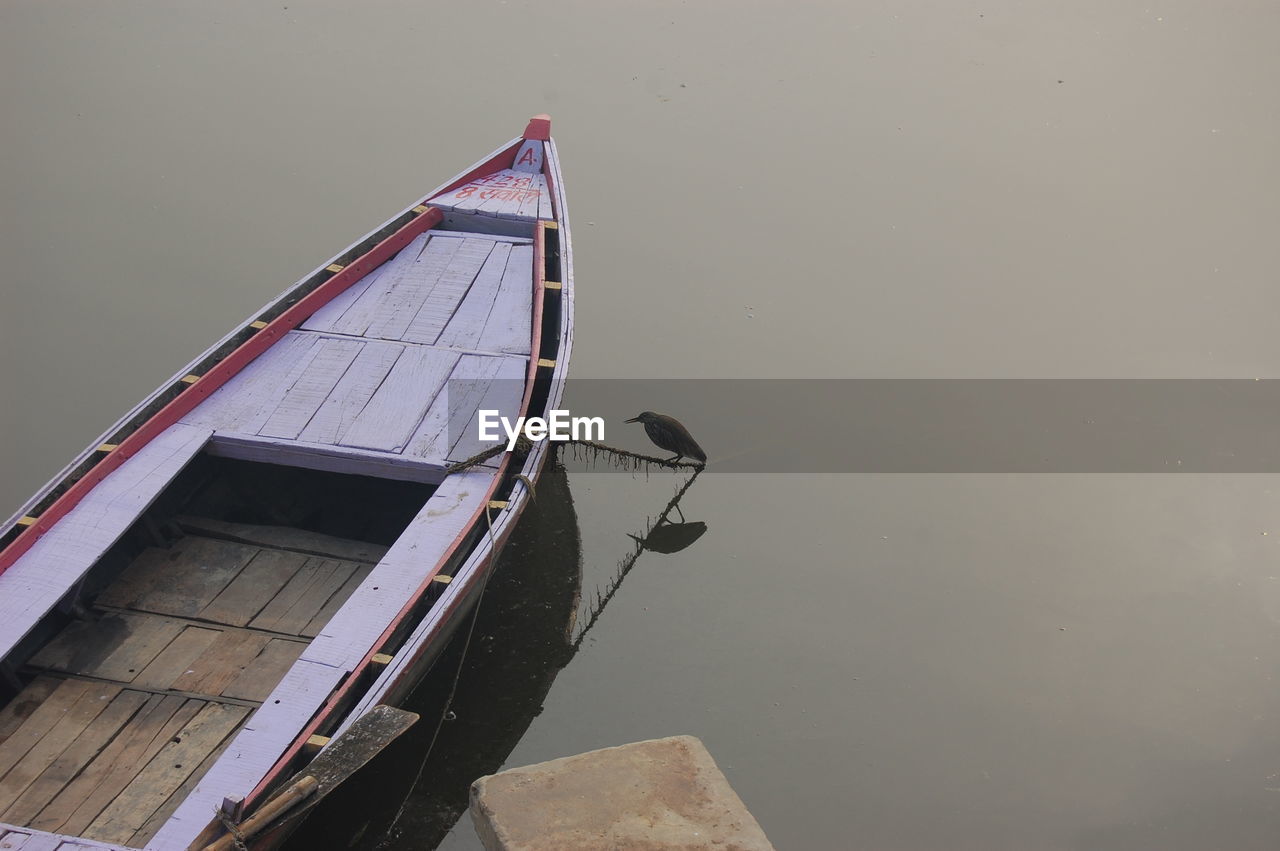 Boat moored on lake