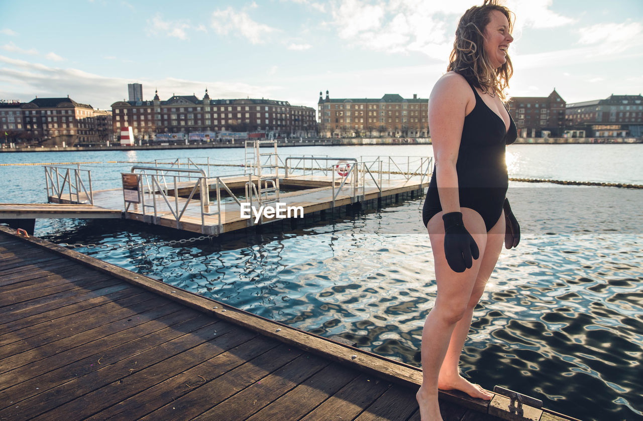Mature woman cold water swimming in copenhagen, denmark