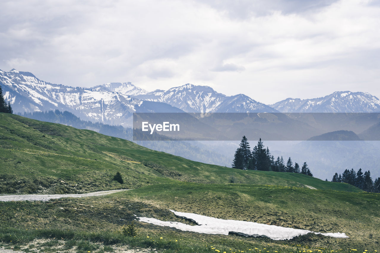 Scenic view of snowcapped mountains against sky