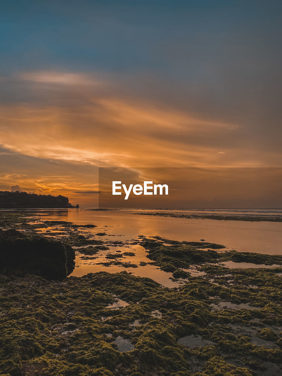 SCENIC VIEW OF SEA AGAINST ORANGE SKY