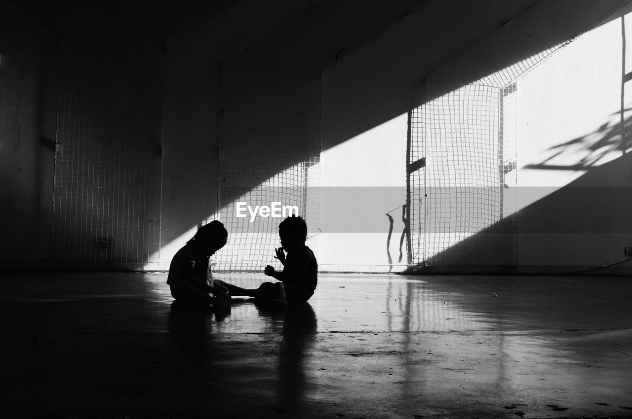 People sitting on wall