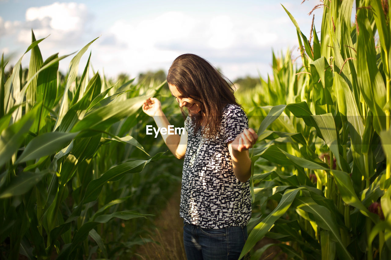 Woman standing in agricultural field