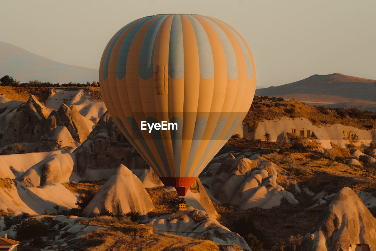 VIEW OF HOT AIR BALLOONS ON ROCK