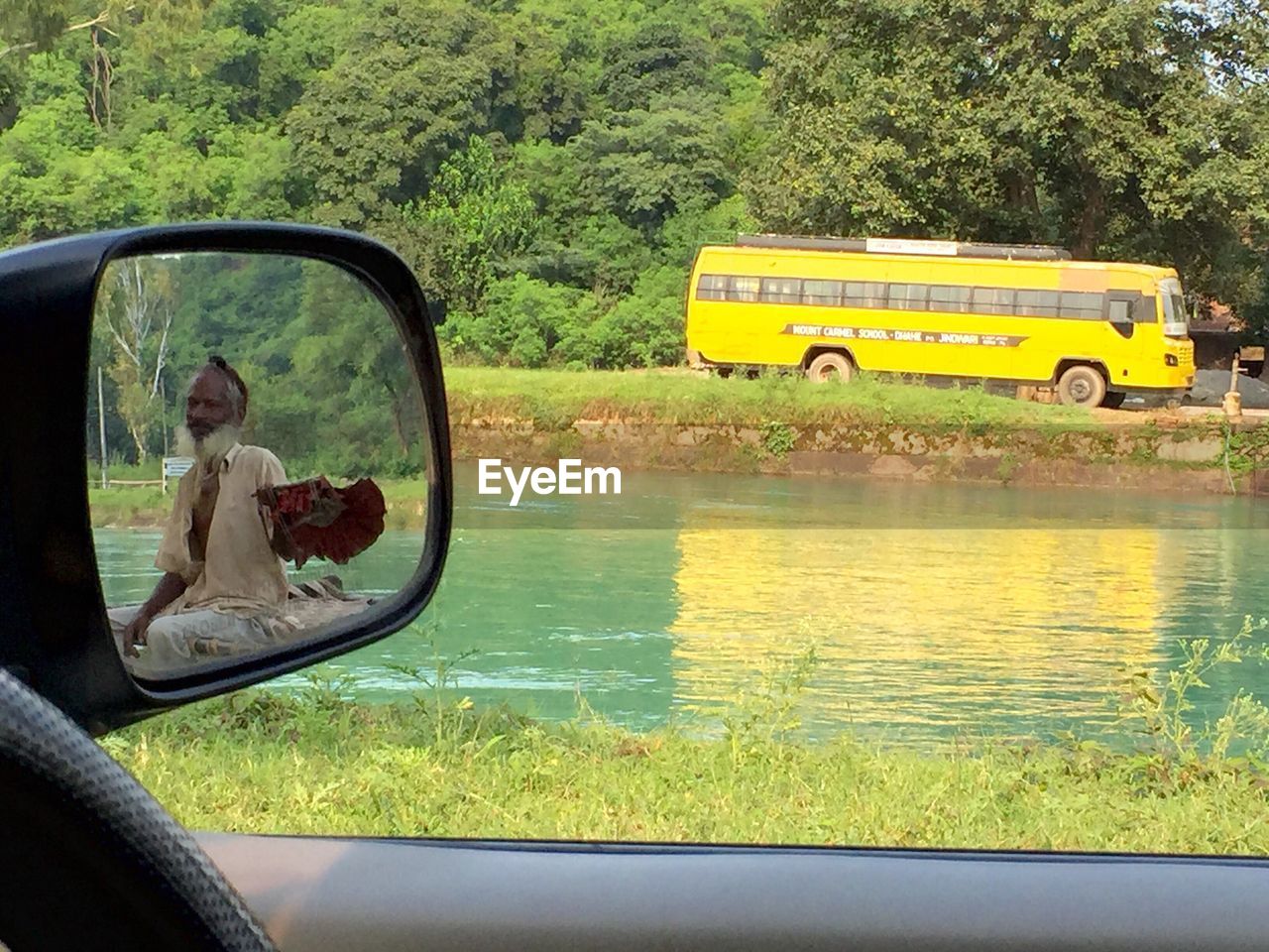 REFLECTION OF PEOPLE IN WATER