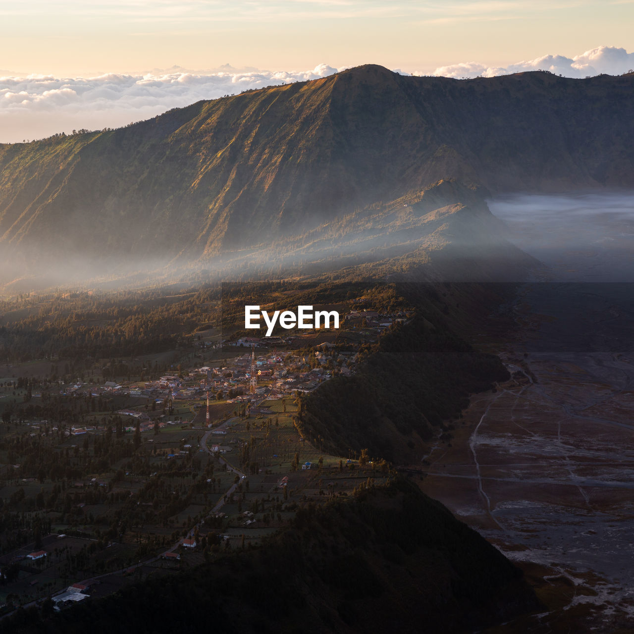 Some clouds cross the village of mount bromo